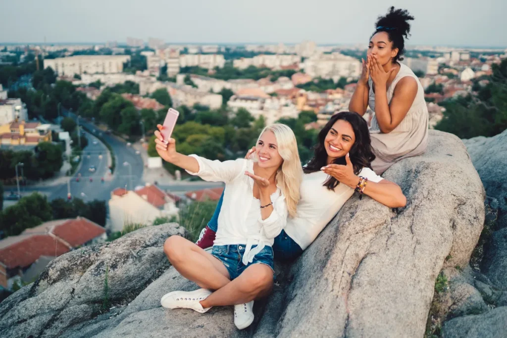 solo women travellers enjoy a sunset together in Cape Town