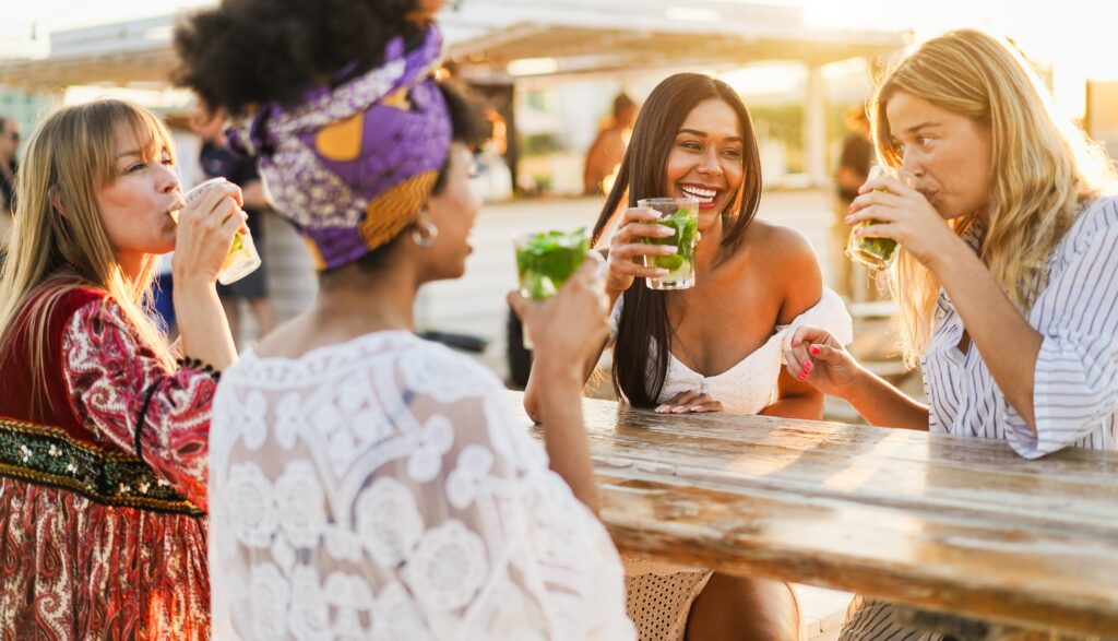 Women enjoy a solo female wine tour together in the cape